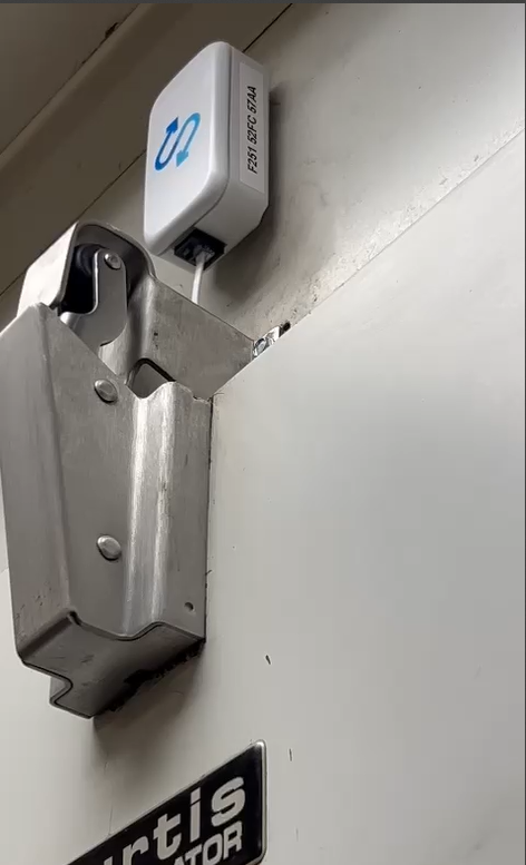 Sensor above a walk-in door latch