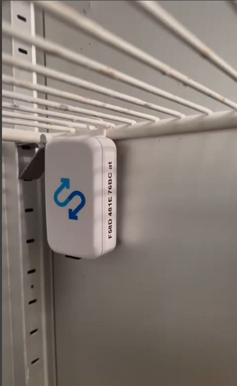 Sensor clipped to a wire shelf